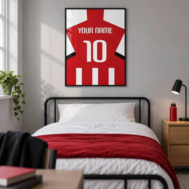 Football Shirt Poster in Red and White Stripes with White Number, framed on the wall of a modern football-loving teenager's single bedroom (13-17) in a UK family home with a pale grey wall