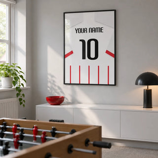 Football Shirt Poster in Red and White Stripes with White Sleeves, framed on the wall of a modest converted spare-room games room in a UK family home with a pale grey wall