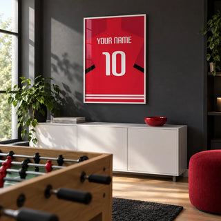 Football Shirt Poster in Red with Black Sleeve Stripe, framed on the wall of a modern games room in a UK family home with a charcoal wall and pale oak floor
