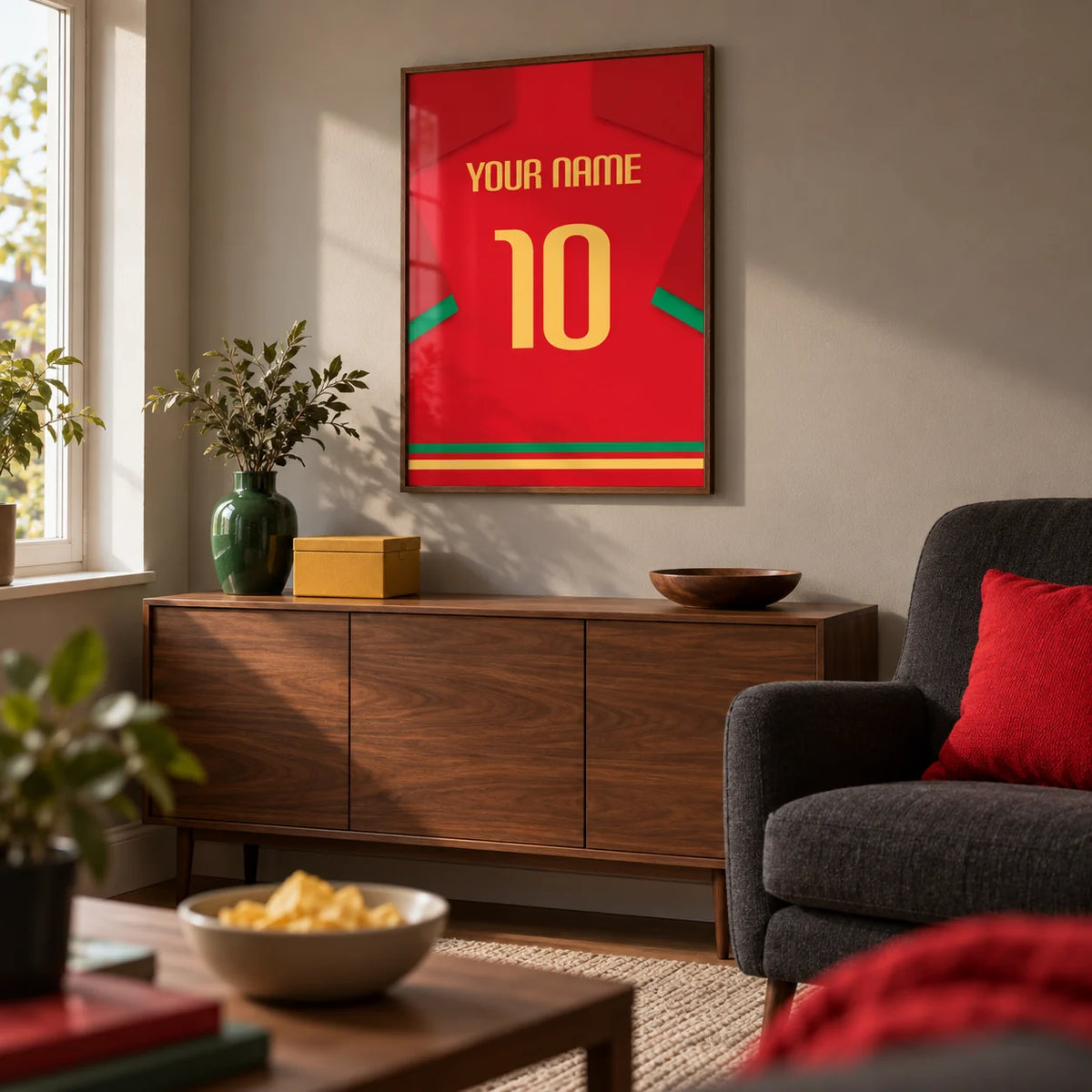 Football Shirt Poster in Red with Green Trim and Yellow Number, framed on the wall of a compact football-viewing snug in a UK semi-detached home with a warm grey wall and walnut furniture in a living room