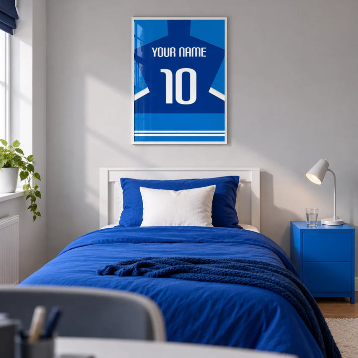 Football Shirt Poster in Two-Tone Blue with White Sleeve Stripes, framed on the wall of a modern football fan's single bedroom in a UK family home