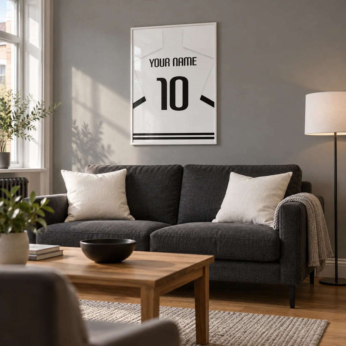 Football Shirt Poster in White with Black Banded Sleeves and Black Number, framed on the wall of a contemporary football viewing snug in a UK terraced house in a living room