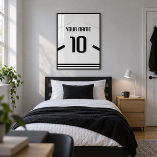 Football Shirt Poster in White with Black Banded Sleeves and Black Number, framed on the wall of a modern football-loving teenager's single bedroom (13-17) in a UK family home