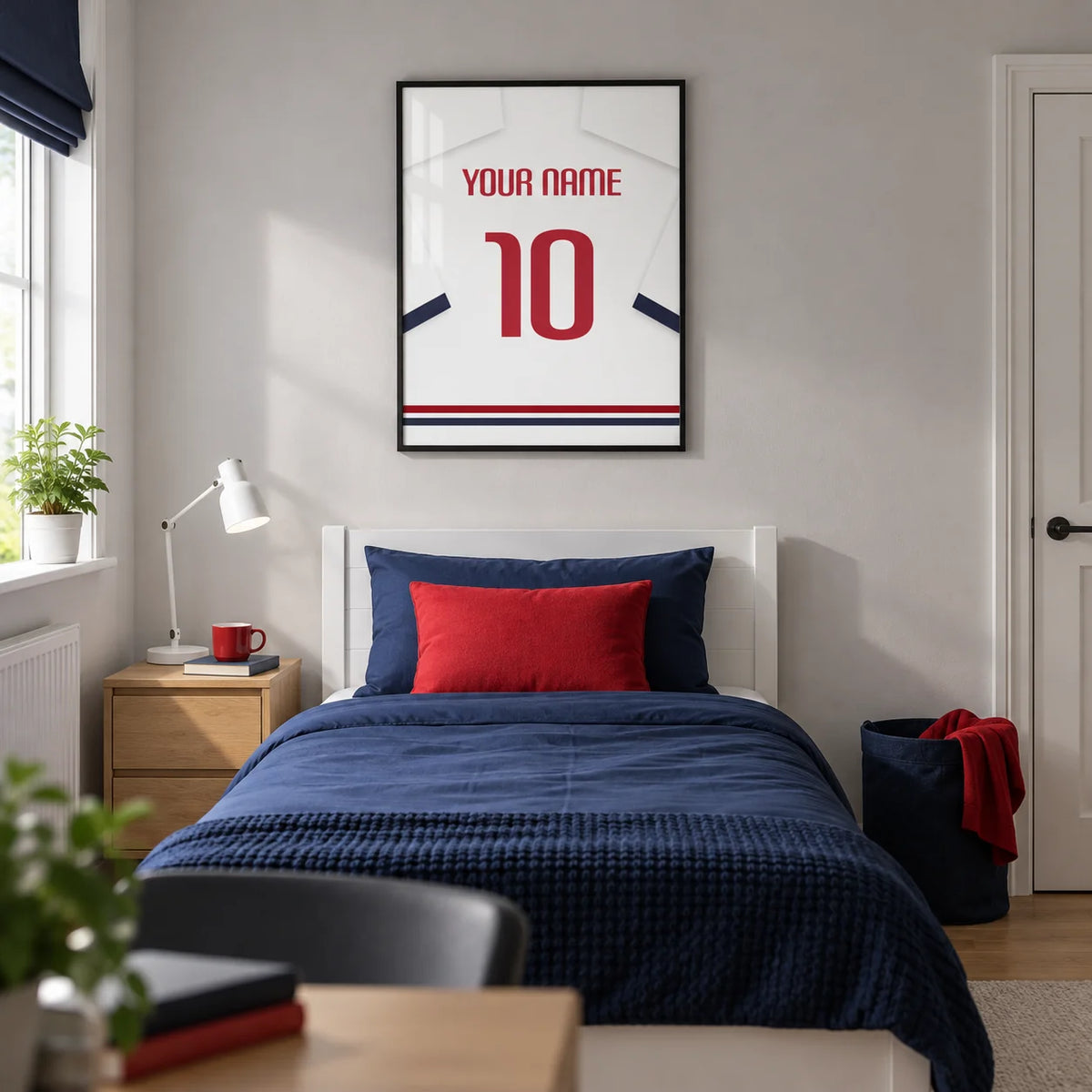 Football Shirt Poster in White with Navy Sleeves and Red Number, framed on the wall of a modern football-loving teenager's single bedroom (13-17) in a UK family home with a pale grey wall and oak floor