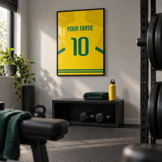 Football Shirt Poster in Yellow with Green Number, framed on the wall of a compact home gym in a converted spare room in a UK home with a light grey wall and plain charcoal rubber flooring