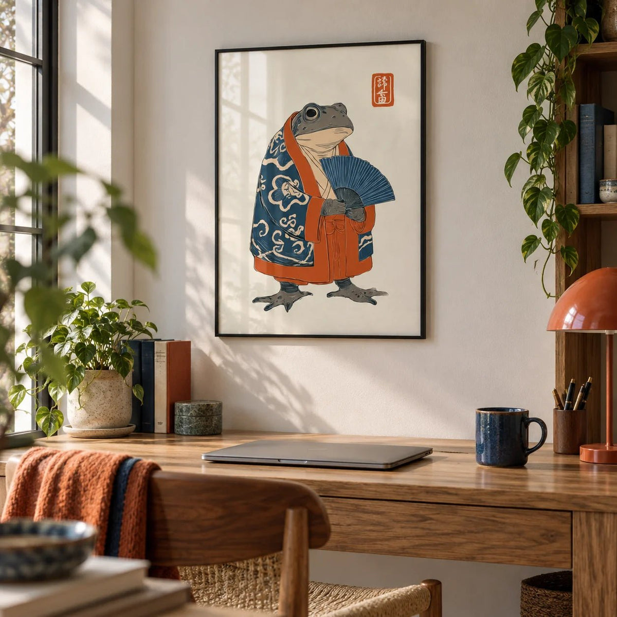 Frog In Kimono Print, framed on the wall of a creative home office