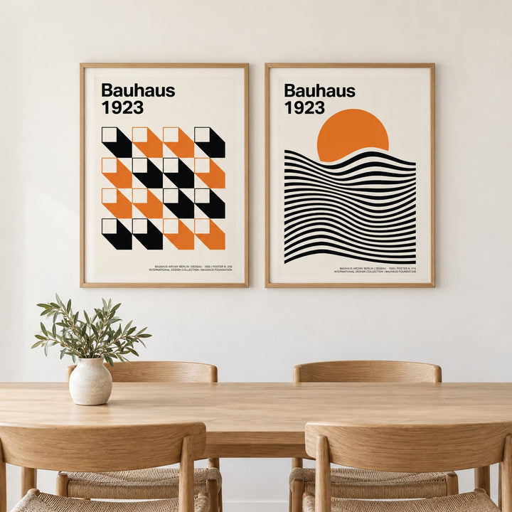 Bauhaus Gallery Wall Art hung at eye level above a dining table: Orange Grid and Bauhaus Sunset shown framed side by side (frames not included)