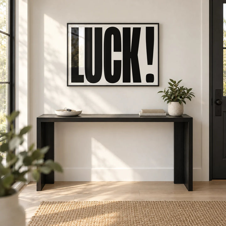 Good Luck Print, framed on the wall of a welcoming entrance hall by the front door with a white wall and a pale oak floor