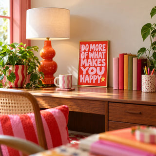 Happiness Print, a small A4 framed print leaning on a desk