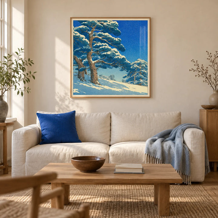 Hasui Kawase Snowy Pines Art Print, framed on the wall of a calm Japanese-influenced living room in a UK terraced house with warm cream plaster walls and an oak floor