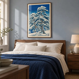 Hasui Kawase Winter Landscape Print, framed on the wall of a peaceful main bedroom in a UK home with a pale blue-grey wall and simple walnut furniture
