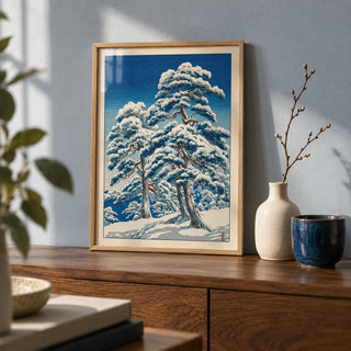 Hasui Kawase Winter Landscape Print, a small A4 framed print leaning on a walnut side table in a hallway