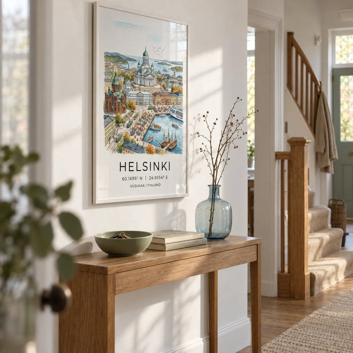 Helsinki Watercolor Art Print, framed on the wall of a bright hallway in a UK terraced home with chalk white walls and a simple oak staircase