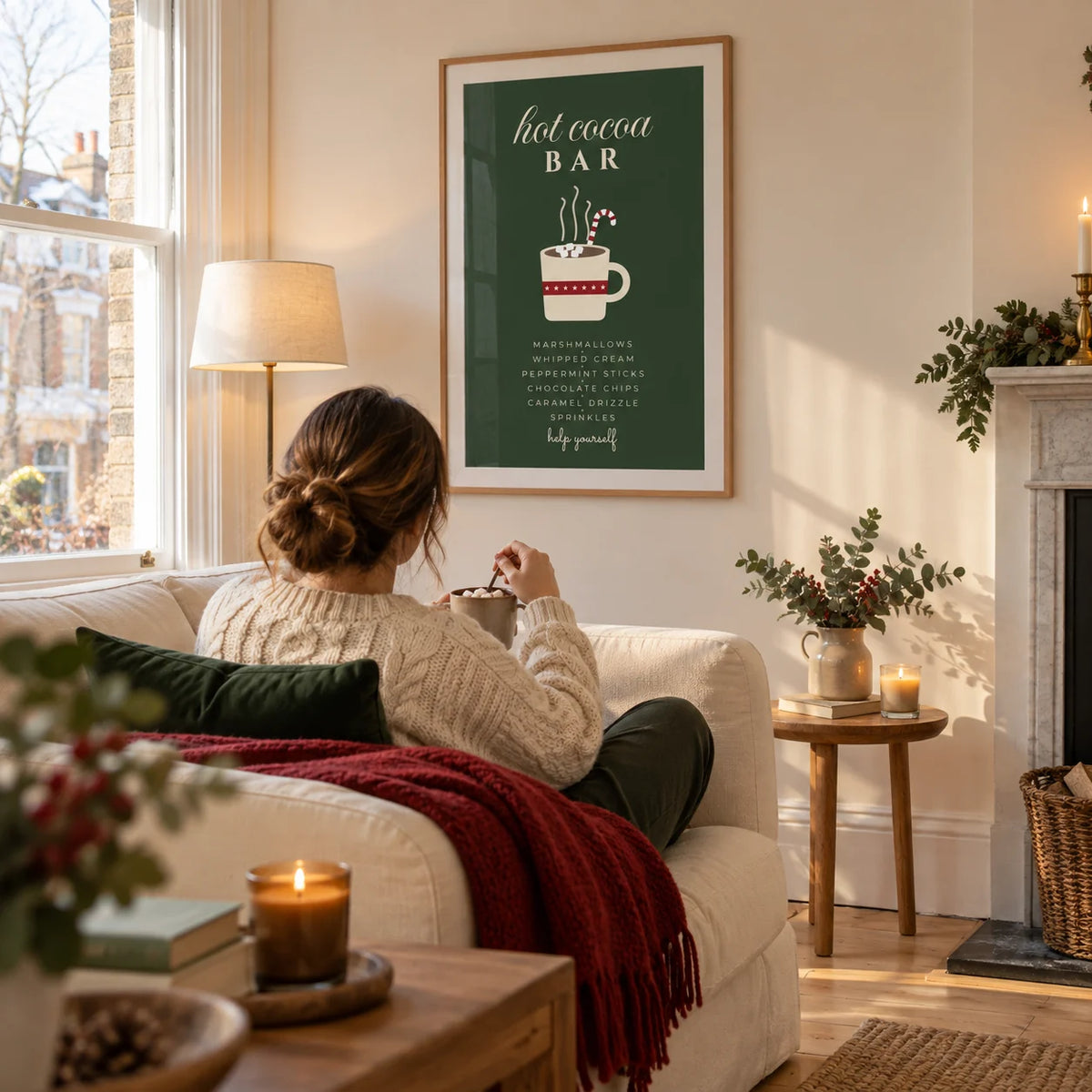 Hot Cocoa Bar Print, framed on the wall of a cosy living room in a UK Victorian terrace with a cream wall and pale wooden floor