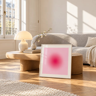 Hot Pink Wall Art, framed and leaning against a coffee table in a bright living room