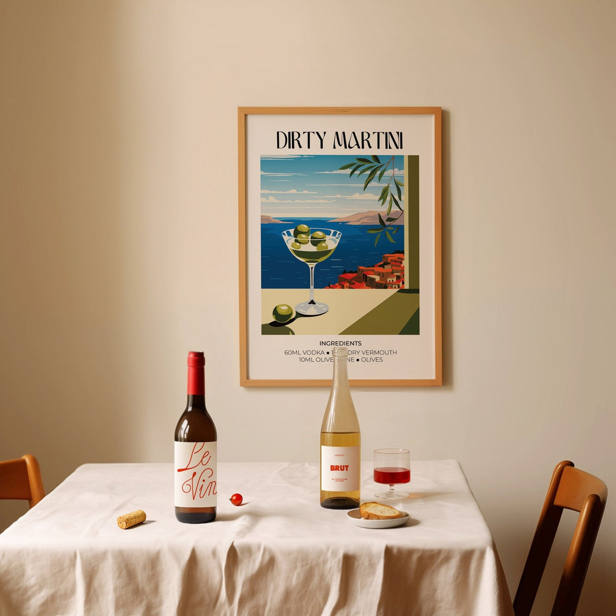 Home Bar Decor wall art of a dirty martini cocktail above a dining table with wine bottles and a glass