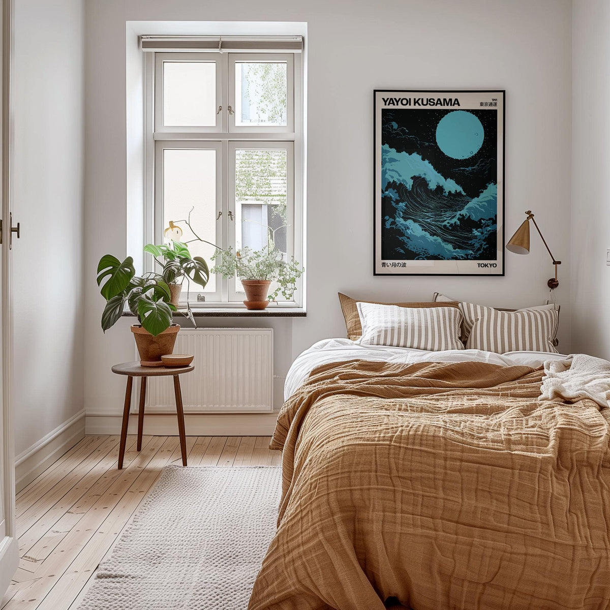 Large Ocean Wall Art print with blue wave and moon above a bed with brown bedding