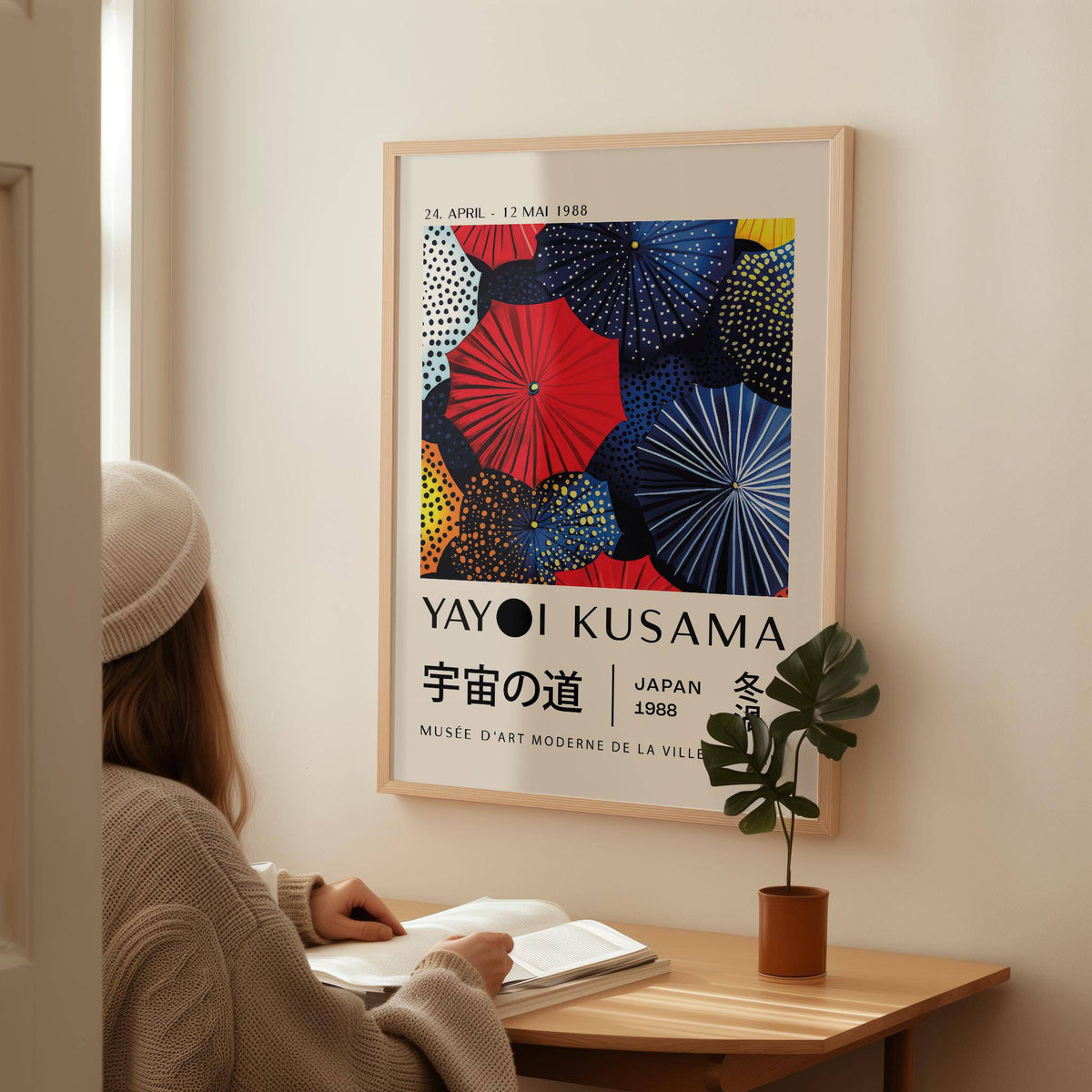 Japanese Home Decor framed print of colourful circular umbrellas above a wooden desk with a plant