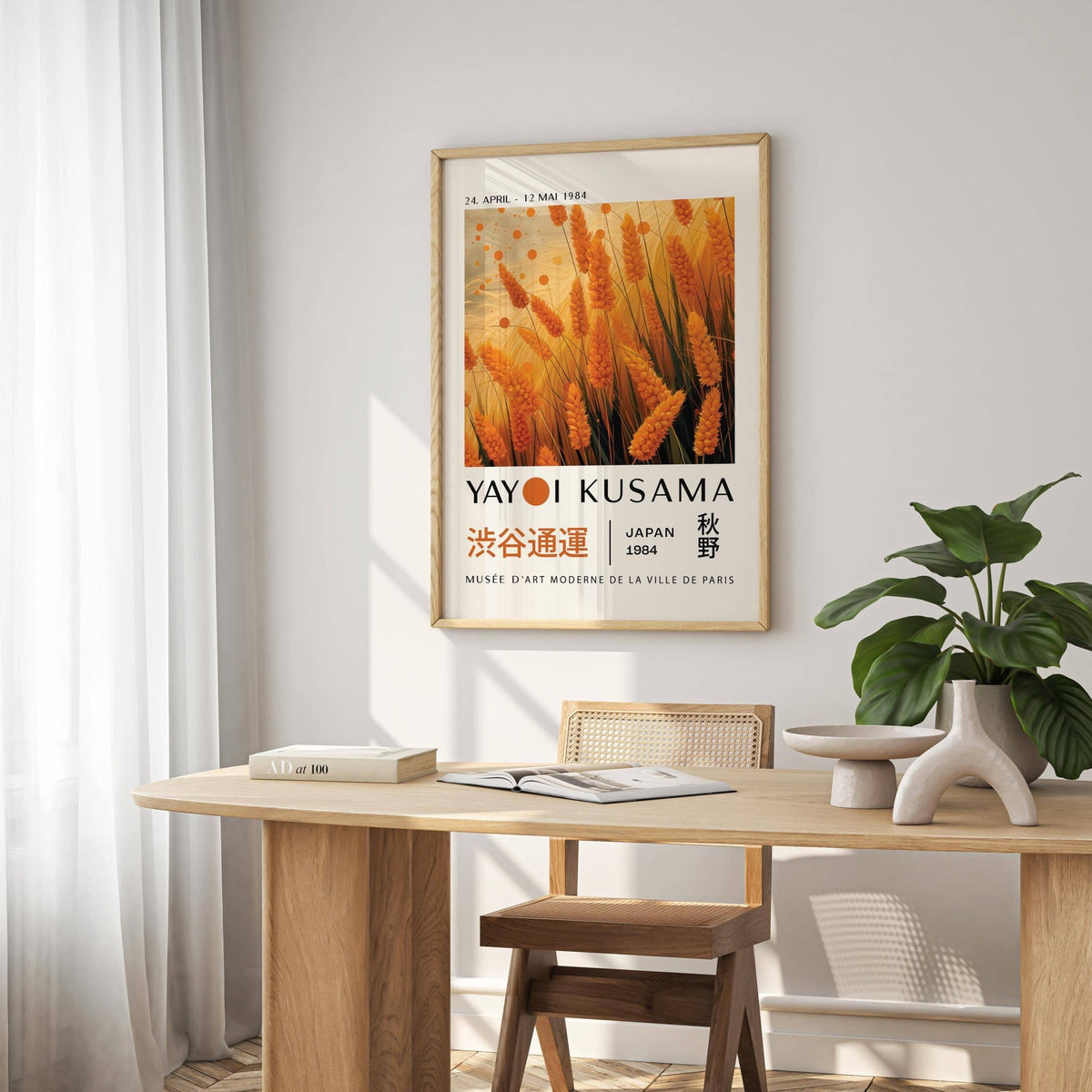 Autumnal wall art of orange wheat with Japanese text in a dining room with a green plant