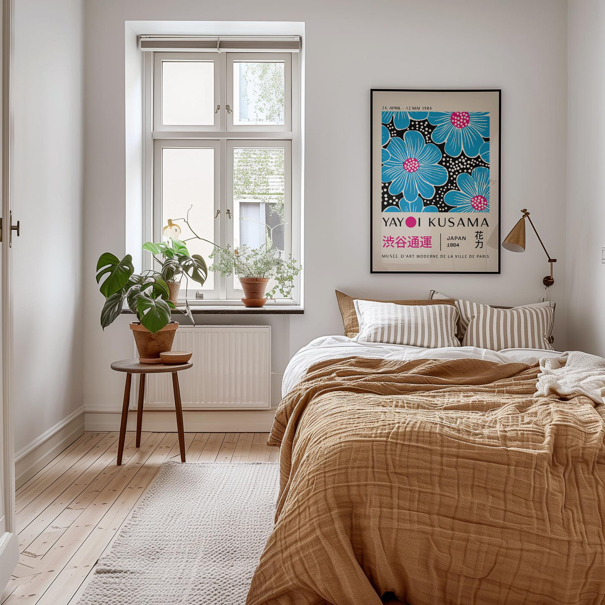 Large Modern Floral Wall Art in black frame above bed with tan bedding and indoor plant on stool