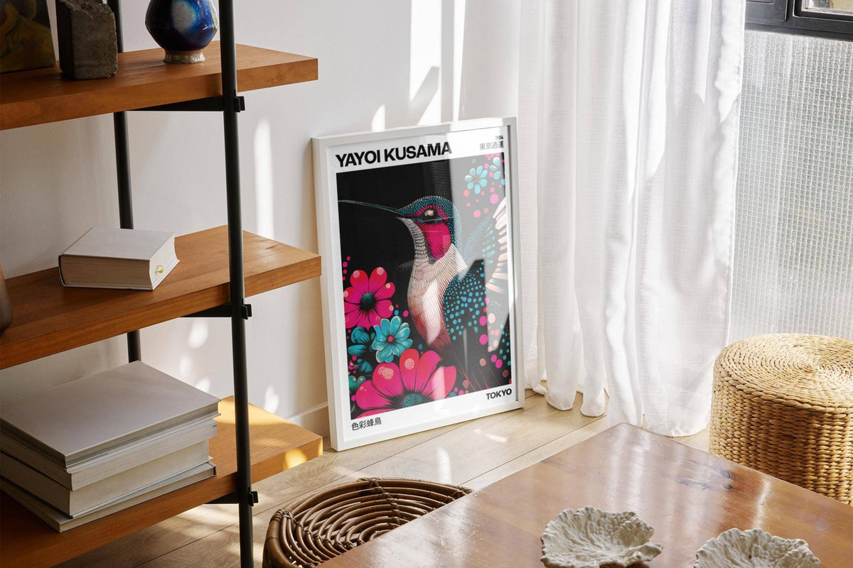 Large Bird Prints leaning hummingbird illustration with bright pink and turquoise flowers in a sunlit room