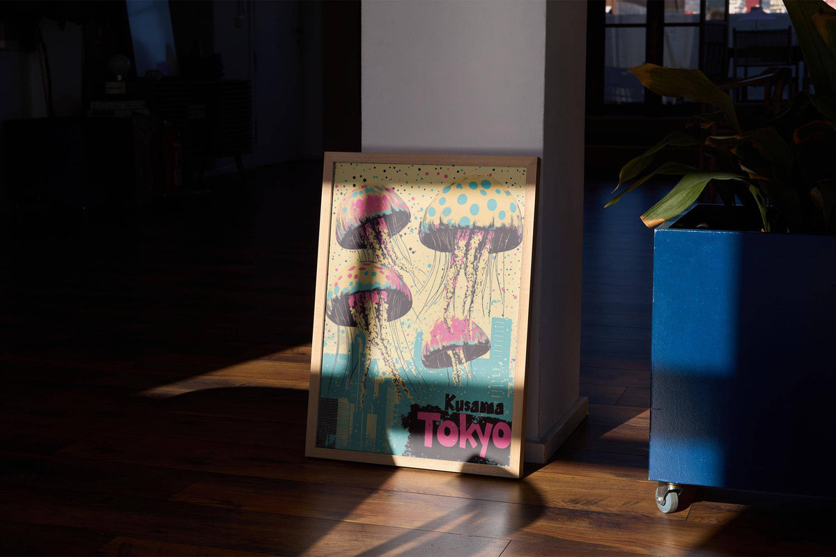 Print leaning on a floor with jellyfish and city skyline in pink blue and yellow with a blue plant pot nearby
