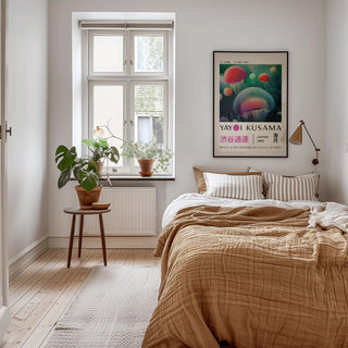 Fish wall decor of glowing jellyfish in bright colours hanging above a bed with a brown duvet