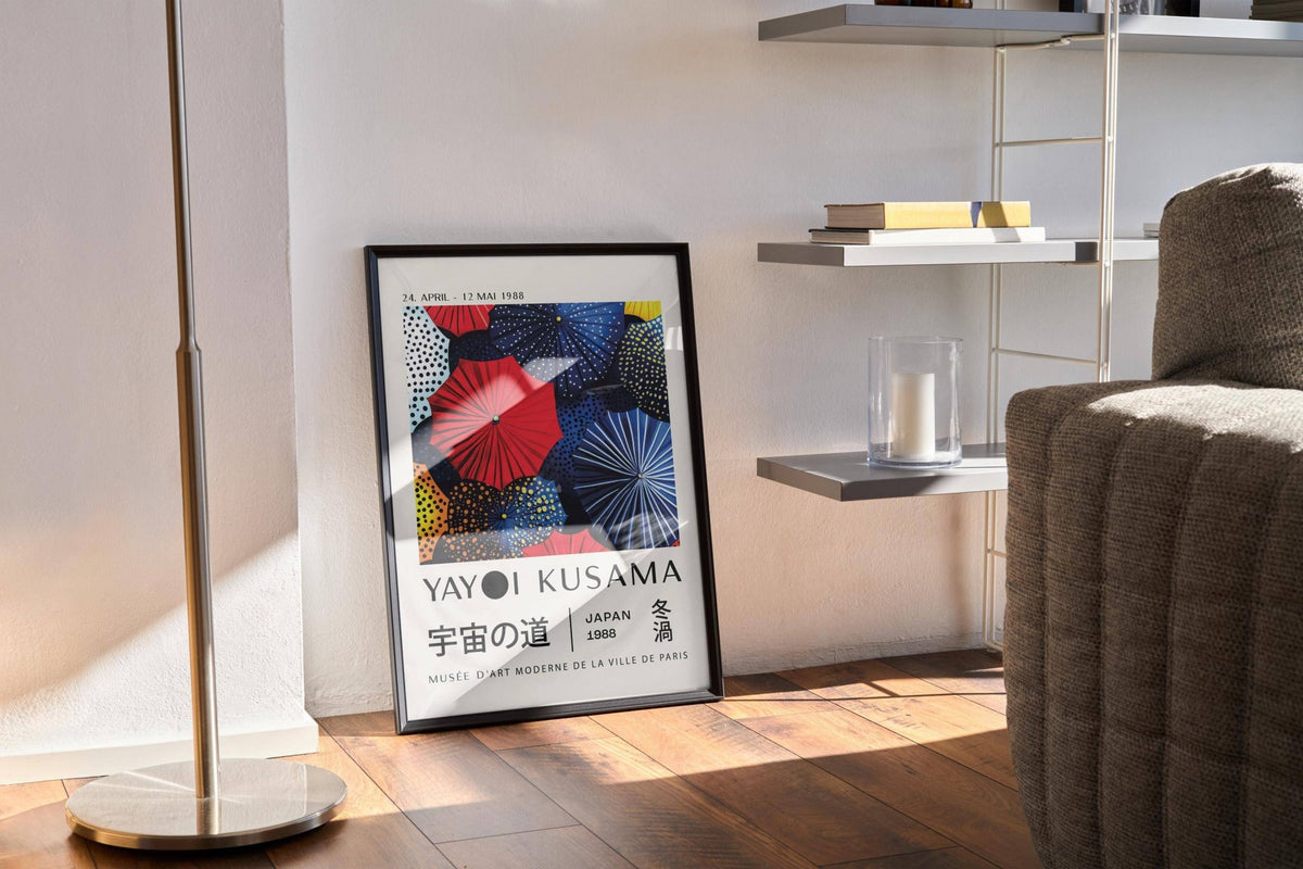 Japanese Home Decor print leaning against a wall near a floor lamp and shelf with books and candle