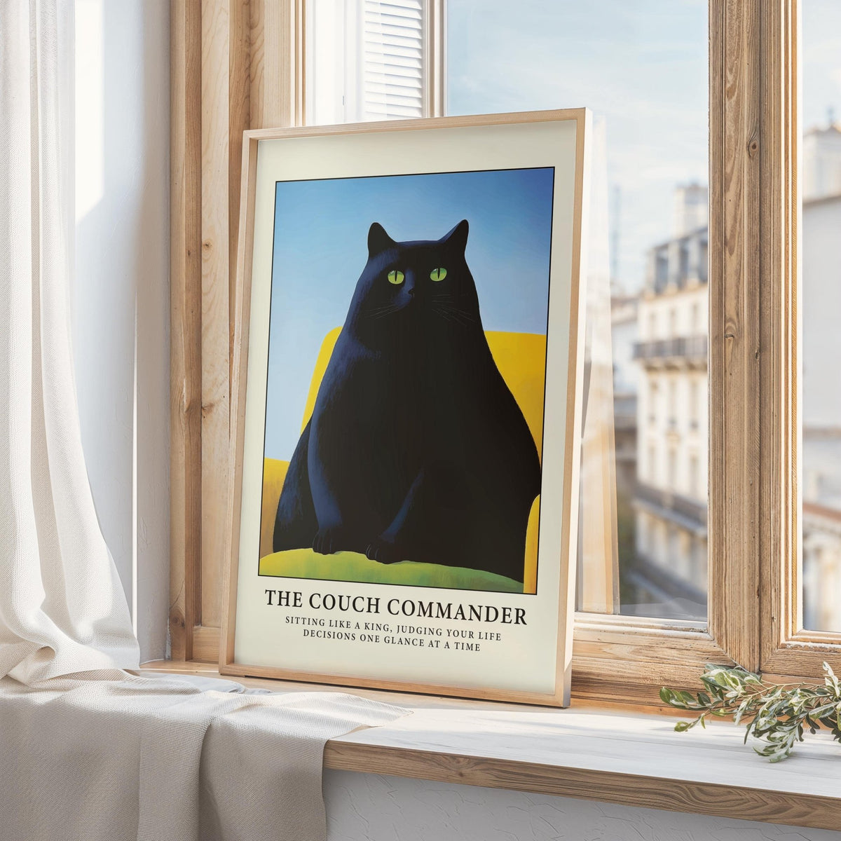 Framed Cat Funny Poster of a black cat on a yellow couch by a window with light curtains