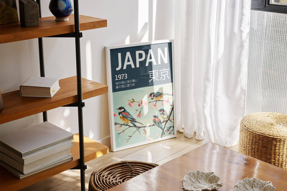 Japanese Bird wall art with swallows on cherry blossom branches leaning against a sunlit window in a living space