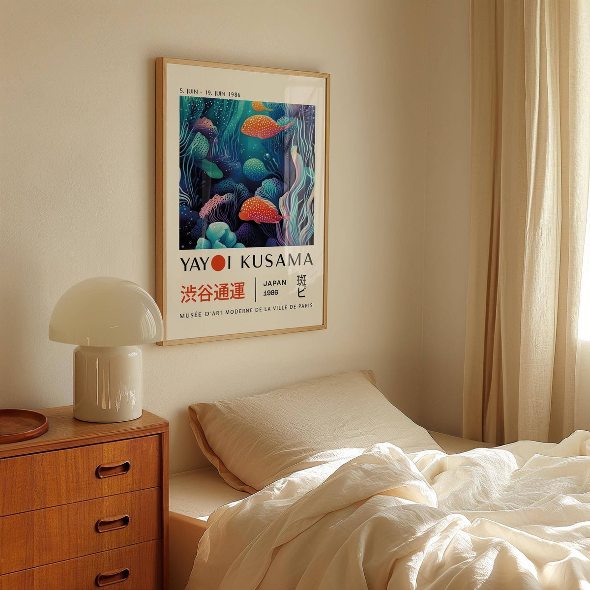Colorful Fish Art framed print with spotted fish in blue and orange hues above a bed with beige bedding