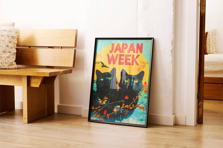 Retro wall prints leaning on floor with black cats and vibrant yellow orange background near wood bench