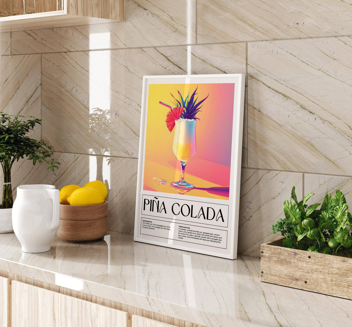 Drink wall art leaning on a kitchen counter with lemons and plants nearby