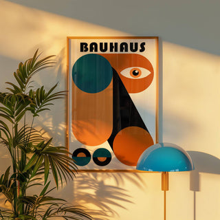 Fun Colorful Print framed with a wooden border in warm sunlight with green plant and blue lamp