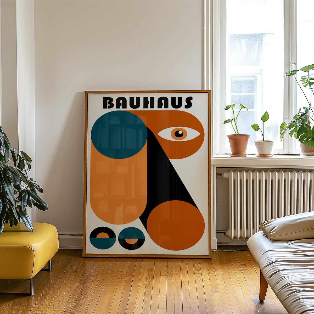 Fun Colorful Print leaning on the floor with large geometric shapes in orange and blue by a window and plants