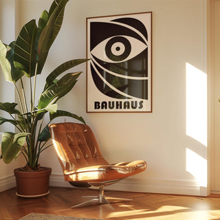 Black Eye Poster print of an abstract eye in black and white above a leather swivel chair with a large plant nearby