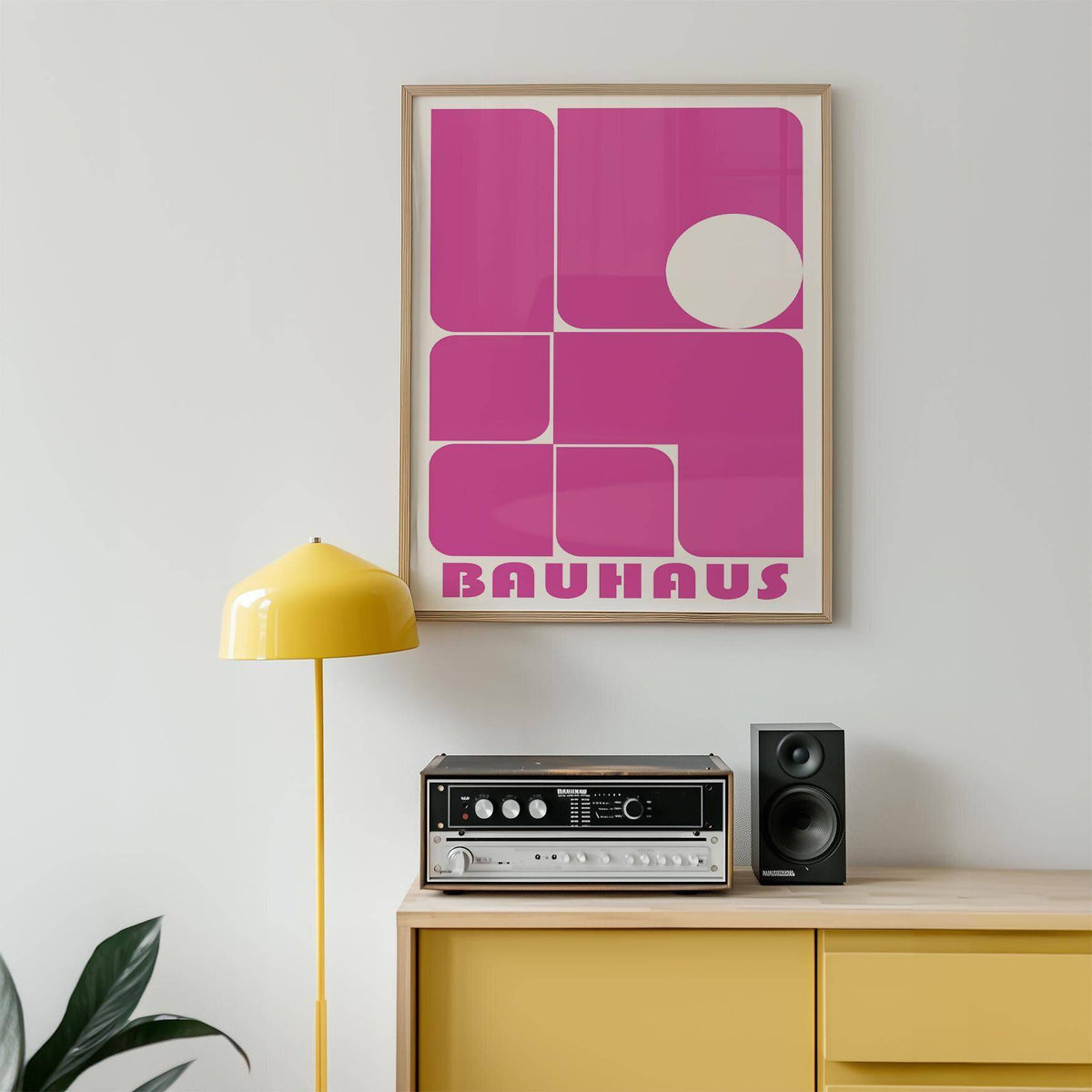 Wall Art Pink in a minimalist room scene with yellow lamp and vintage speaker on cabinet