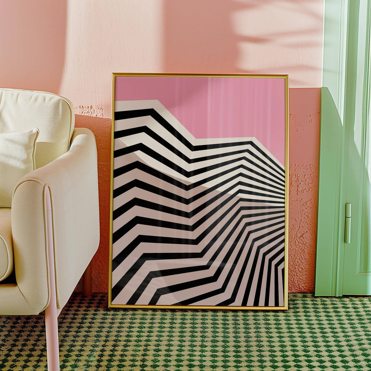 Print leaning with black and white zigzag pattern and pink background beside a cream sofa