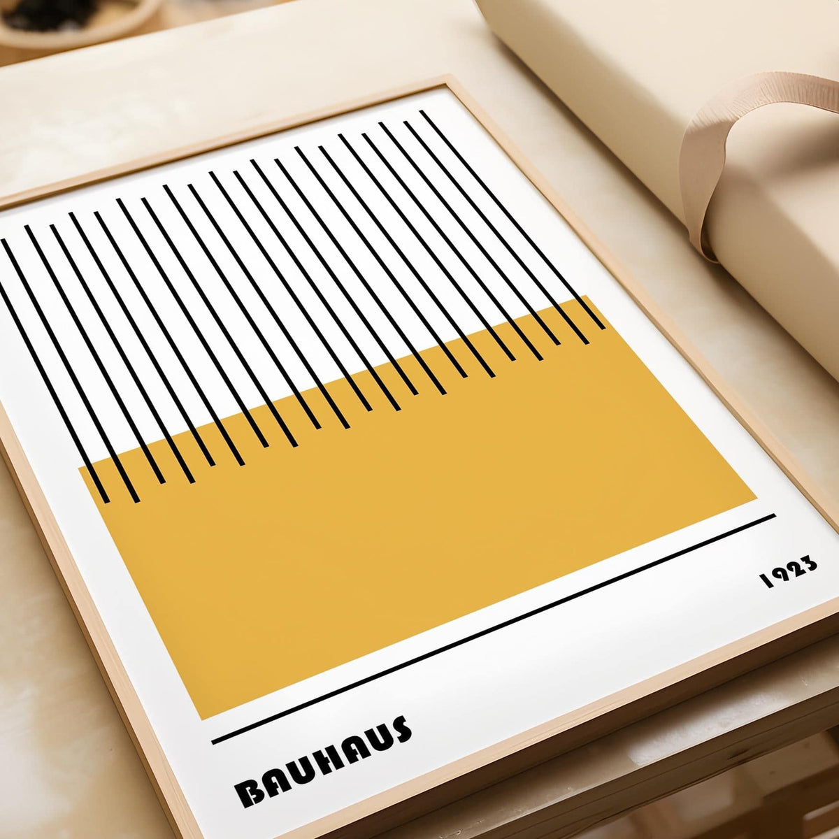 Framed Modern Geometric Art showing yellow rectangle with black vertical lines on a table near brown paper