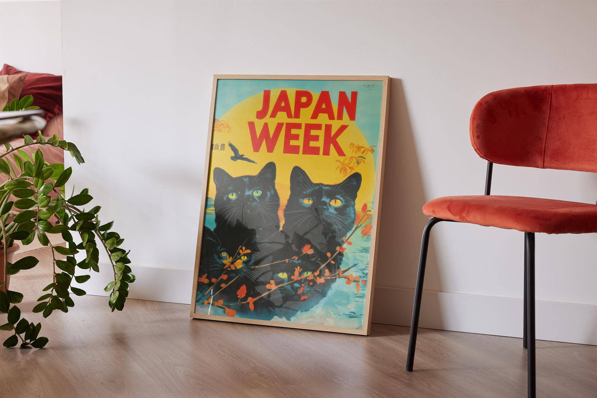 Retro wall prints leaning with black cats and bright yellow sun near a plant and red chair