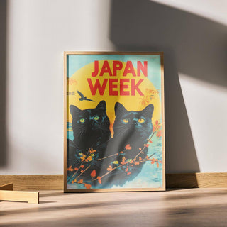 Retro wall prints featuring black cats with yellow eyes and bright red text in natural light on floor