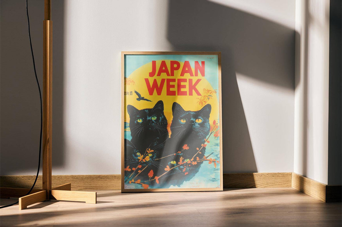 Retro wall prints featuring black cats with yellow eyes and bright red text in natural light on floor