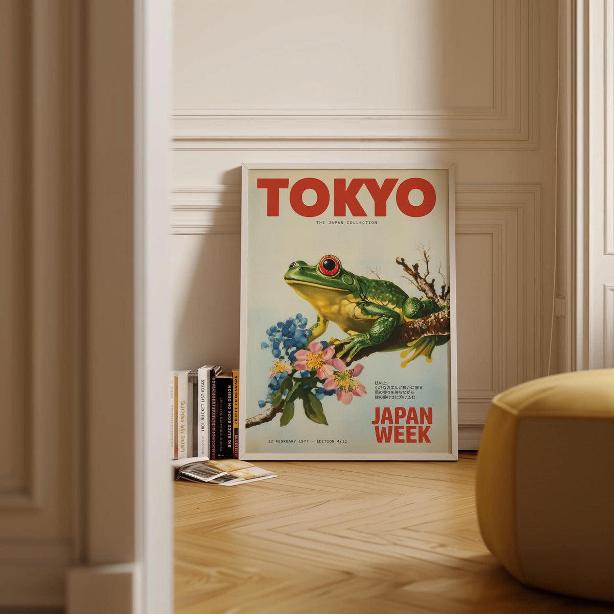 Frog wall art with a green frog on a branch with flowers leaning on a white skirting board