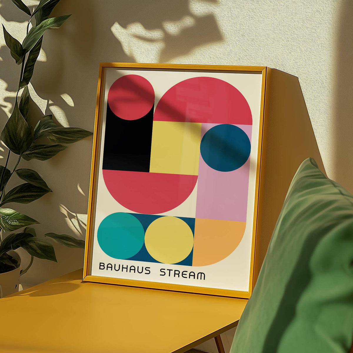 Framed Large Colourful Wall Art leaning on yellow table with green cushion and plant shadows
