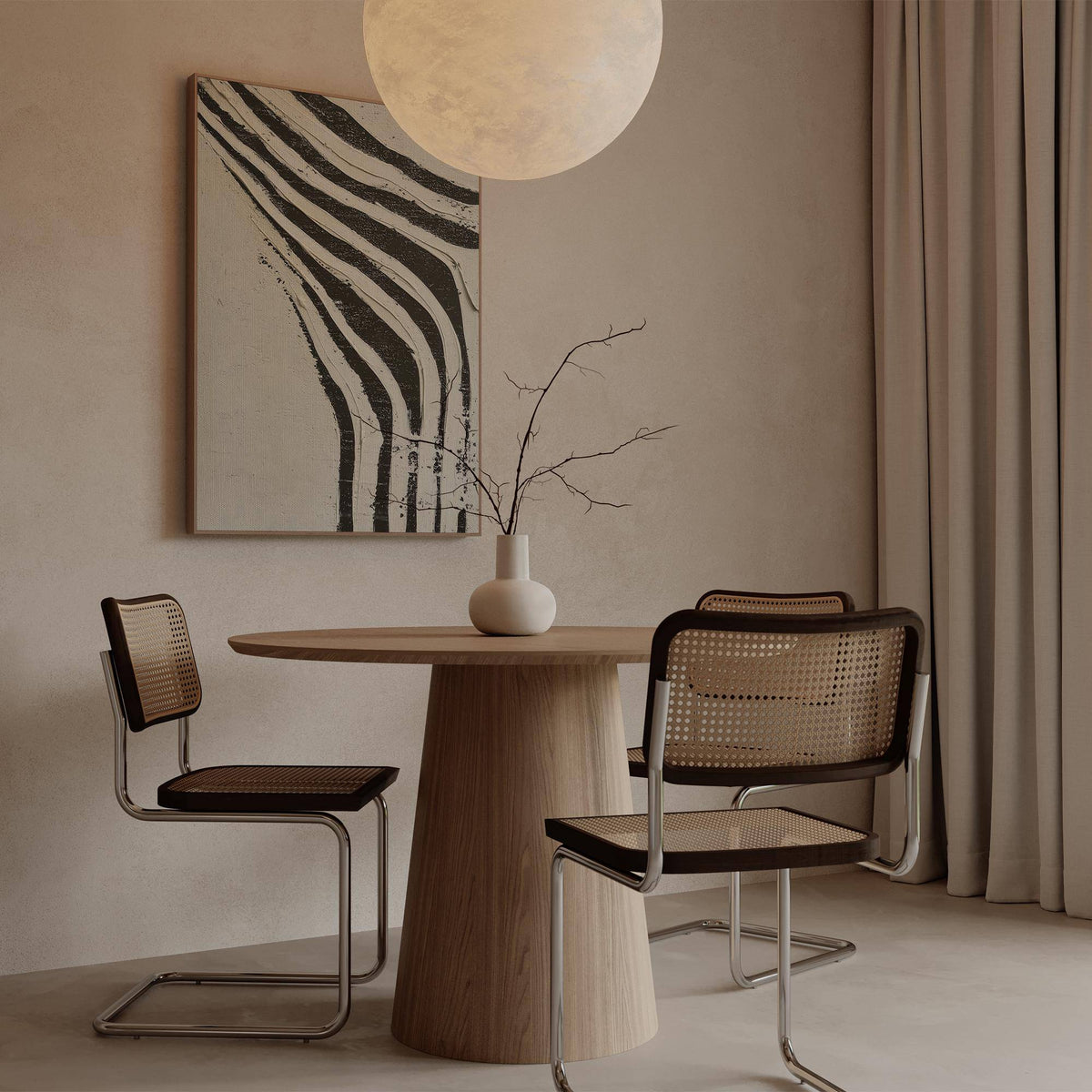 Big Abstract Art with black and white zebra stripes above a round wooden table with a vase and branches