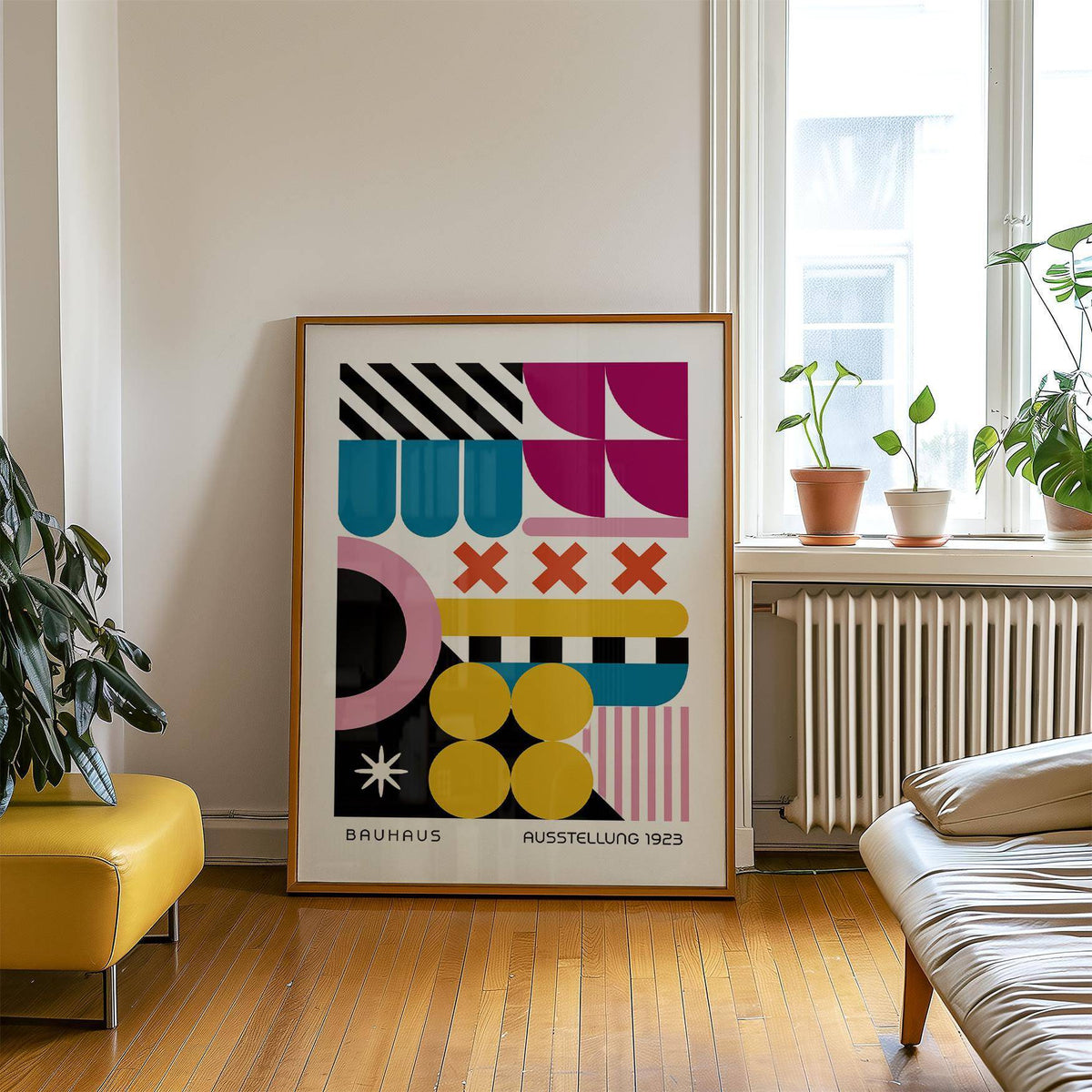 Colorful Prints print leaning on floor by a window with potted plants and wooden floor