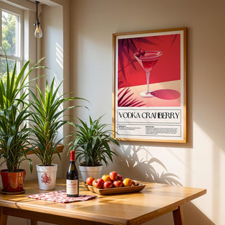 Home Bar Print of a vodka cranberry cocktail in red tones above a wooden table with fruit bowl in a sunlit room