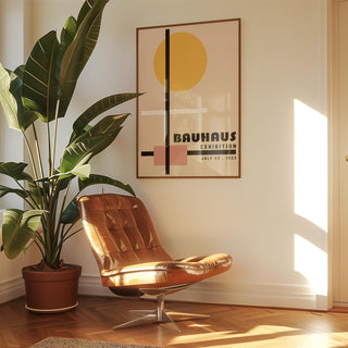 Office prints framed minimalist geometric shapes with yellow circle and typographic text above a brown leather chair