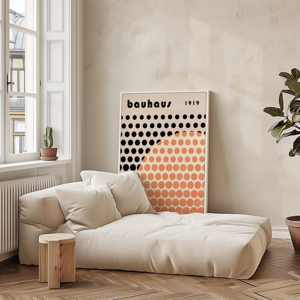 Cool Art Poster leaning by a cream sofa with beige cushions and a small wooden side table