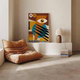 Geometric poster leaning on ledge showing abstract eye and shapes in brown and blue with lamp and chair